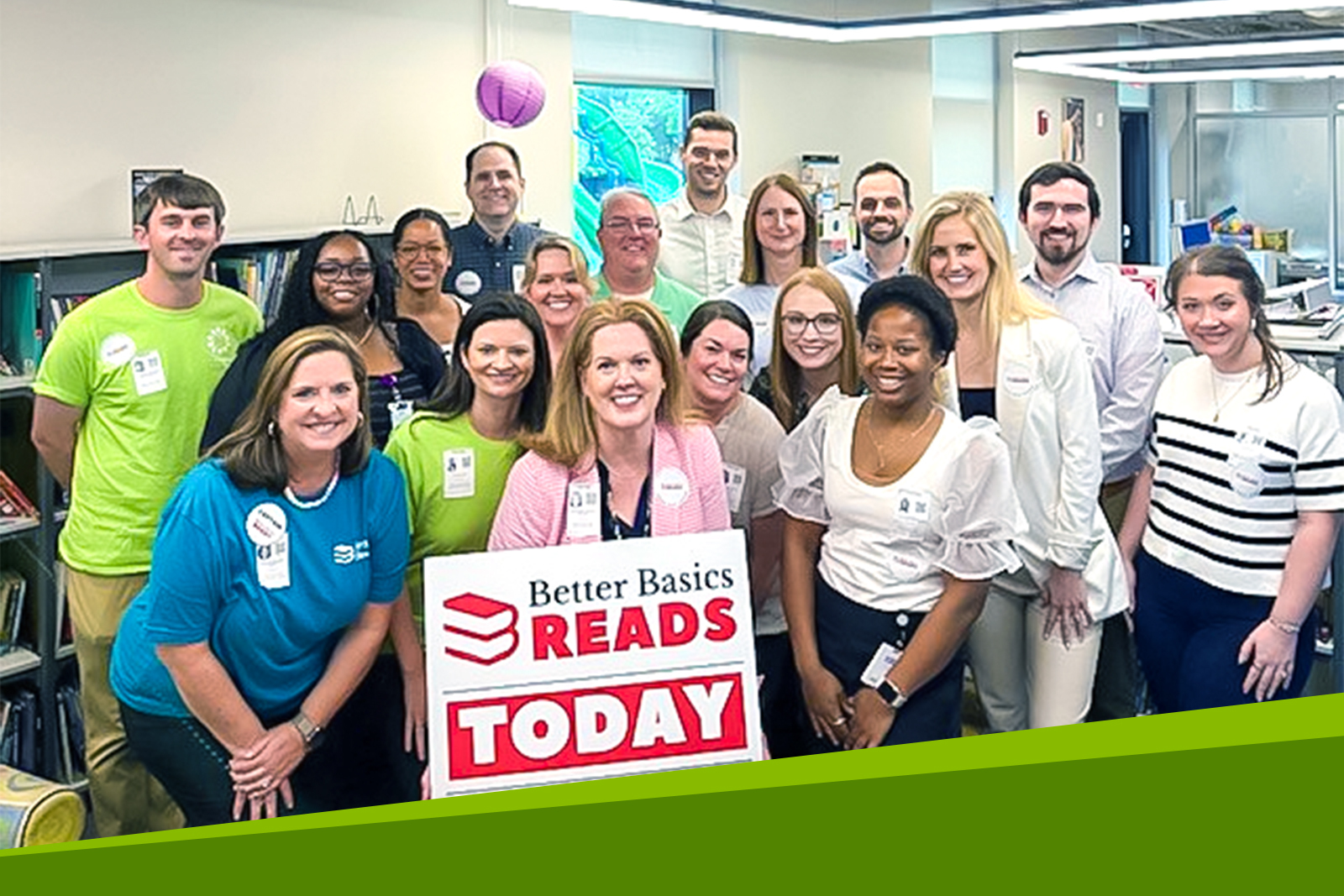 Group photo with a woman in the front of the...