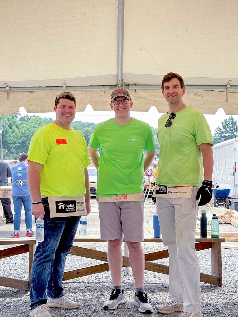 Group of three men from Regions preparing to work on a Habitat for Humanity build.