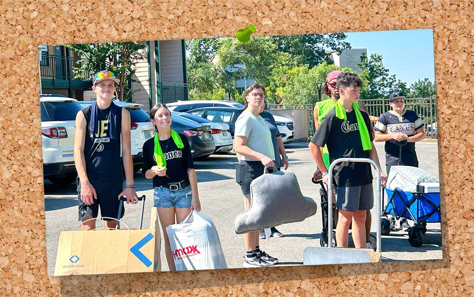 Students moving in to Arkansas State University campus.