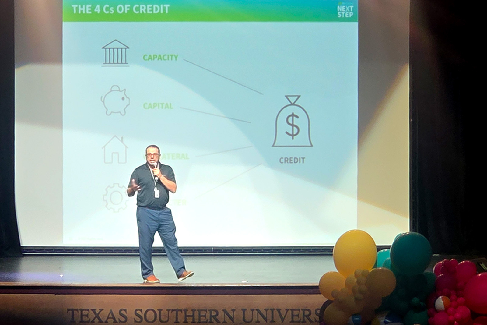 Jason Escobedo presenting on stage.