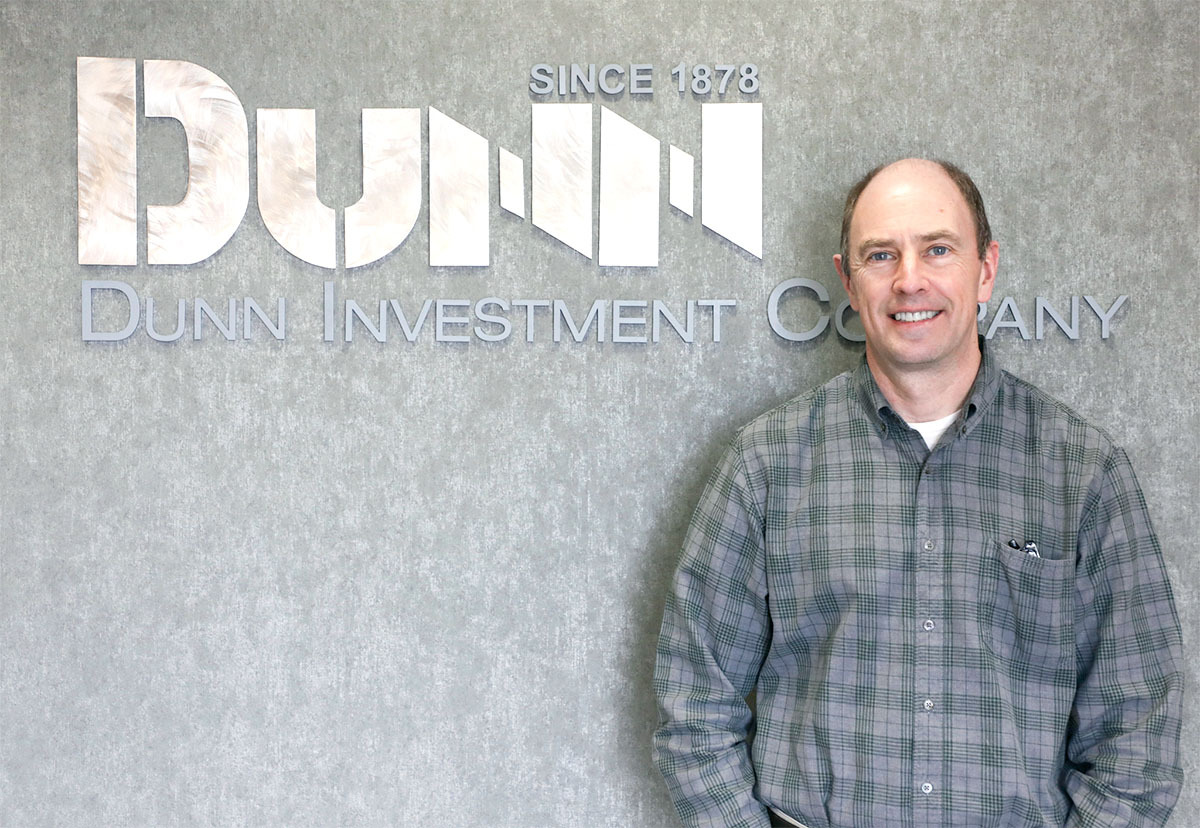 Will French next to his company sign "Dunn."