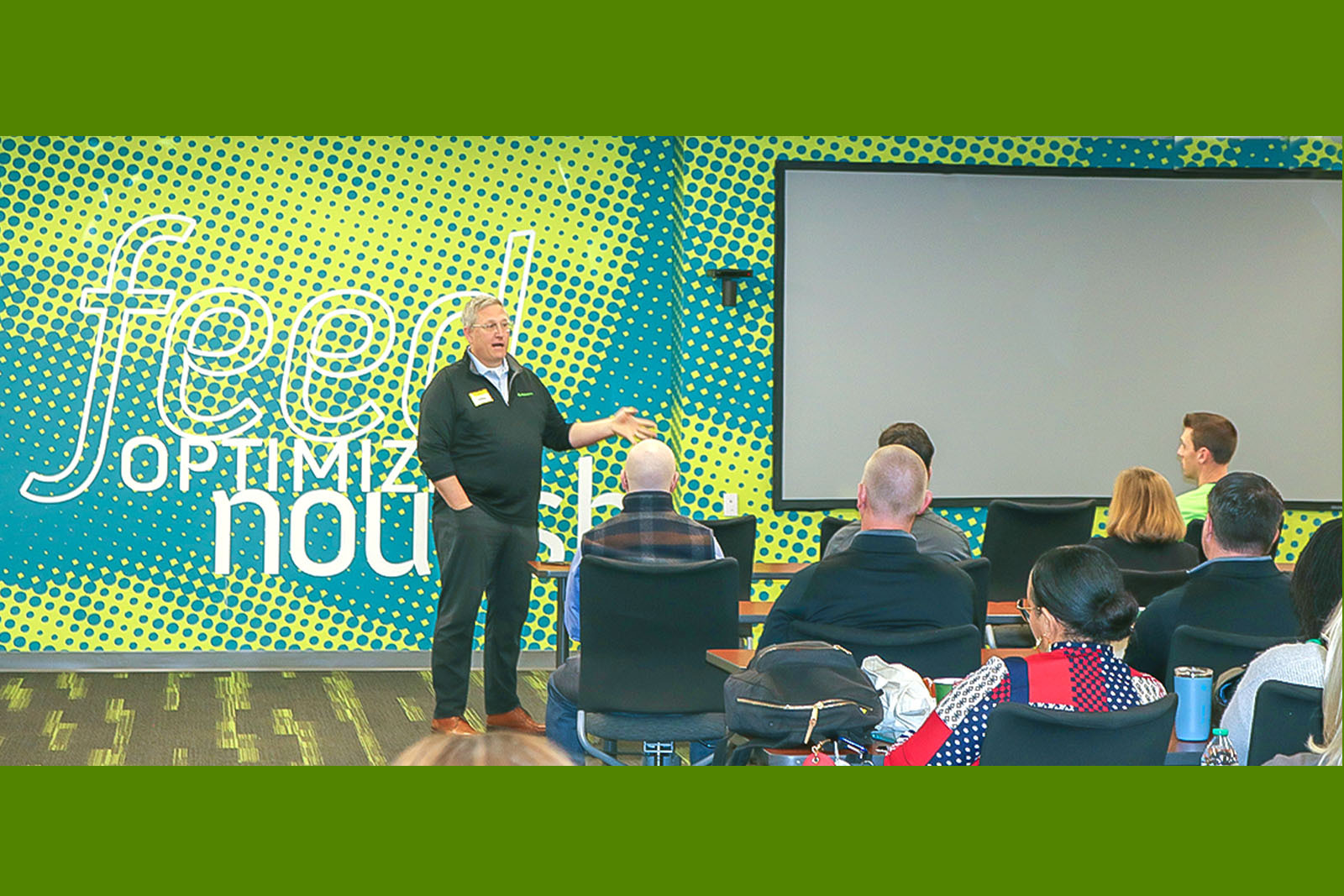Erick Miner speaking to an audience at Gleaners Food Bank.