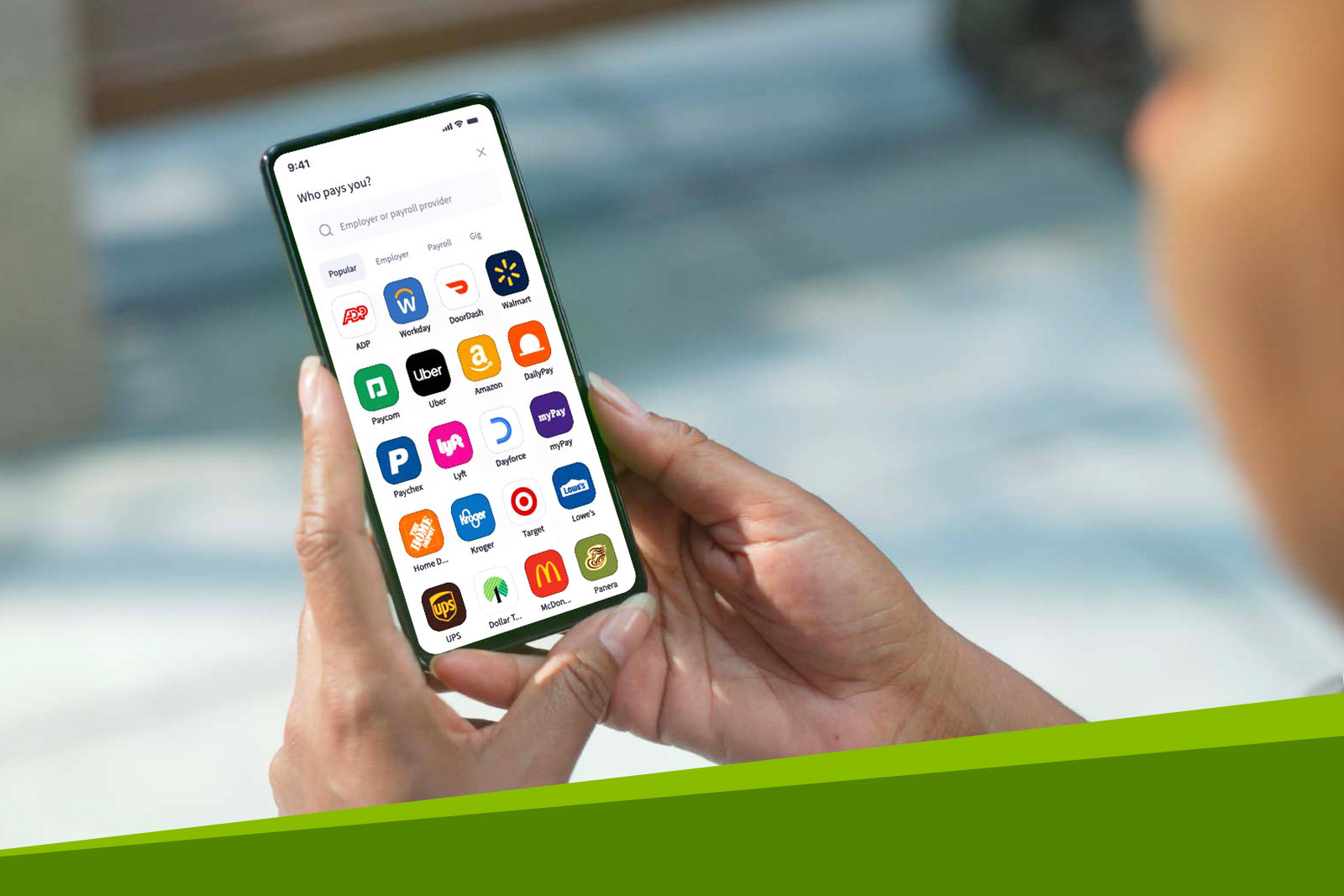 African American woman holding a phone with the Regions Direct...