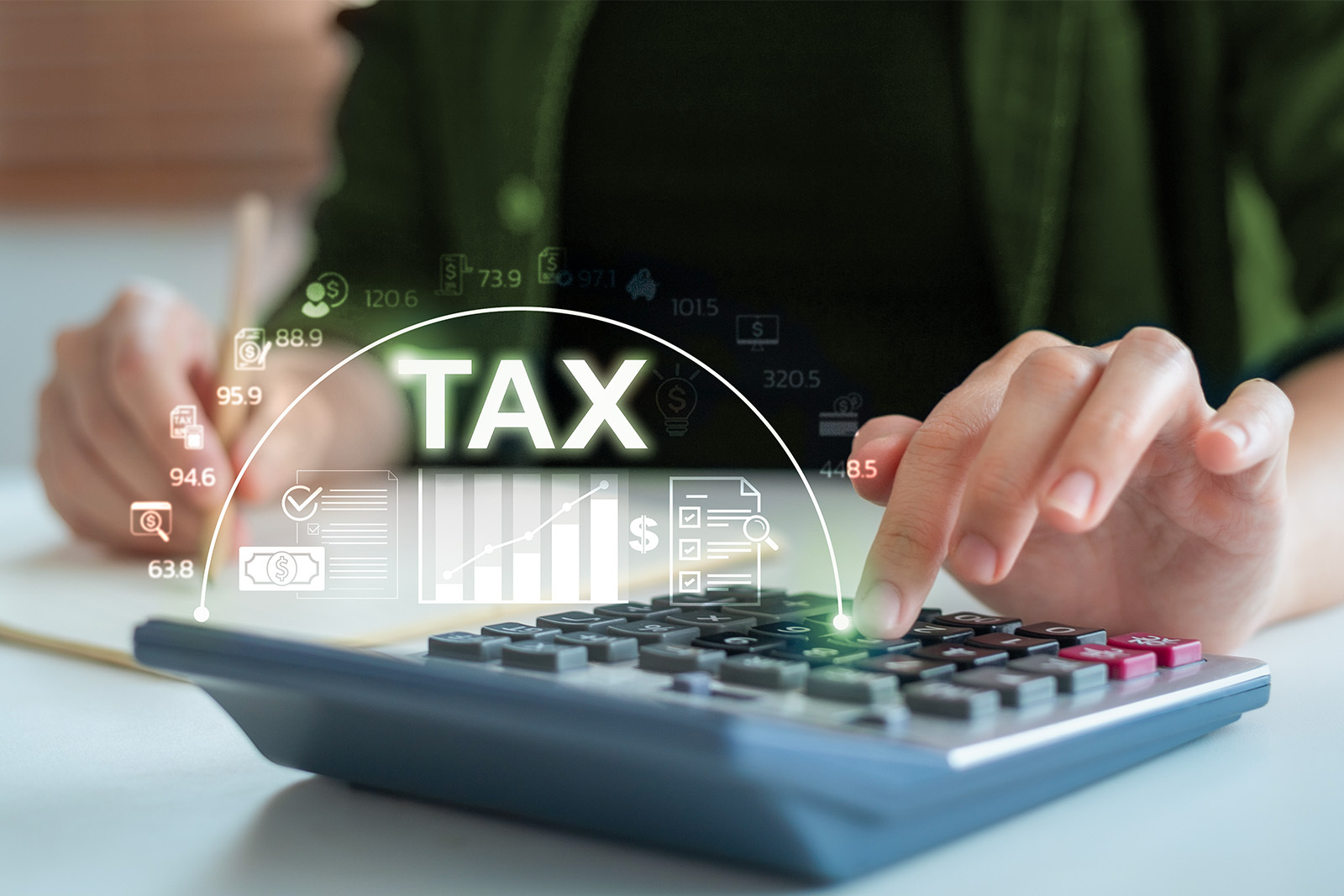 Person using a calculator with a tax overlay icons.