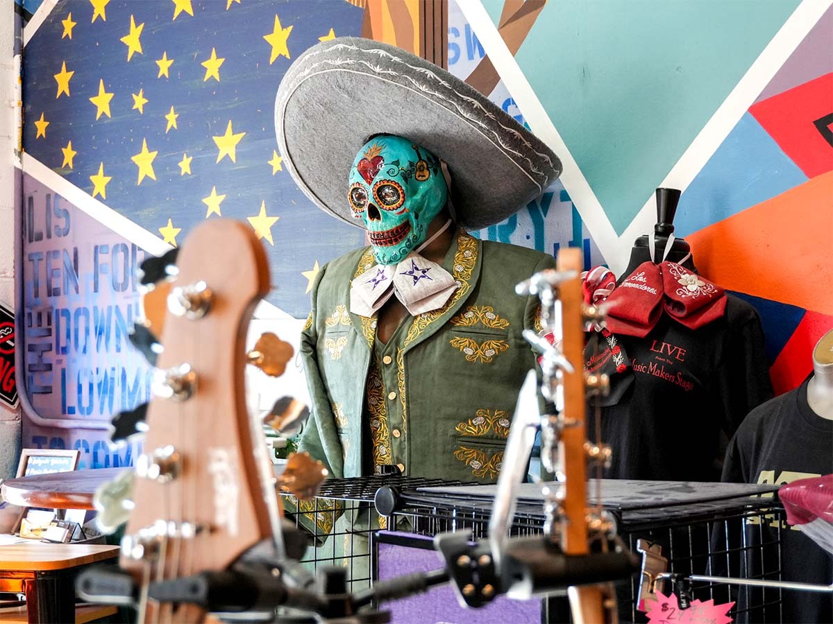 Dia De Los Muertos figure in the Delgado Guitars store.