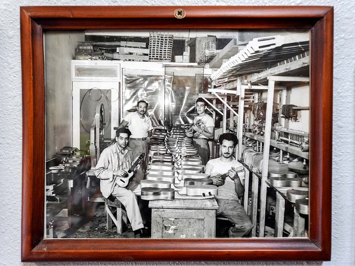 A black and white framed photo of the original owners and employees of the shop.
