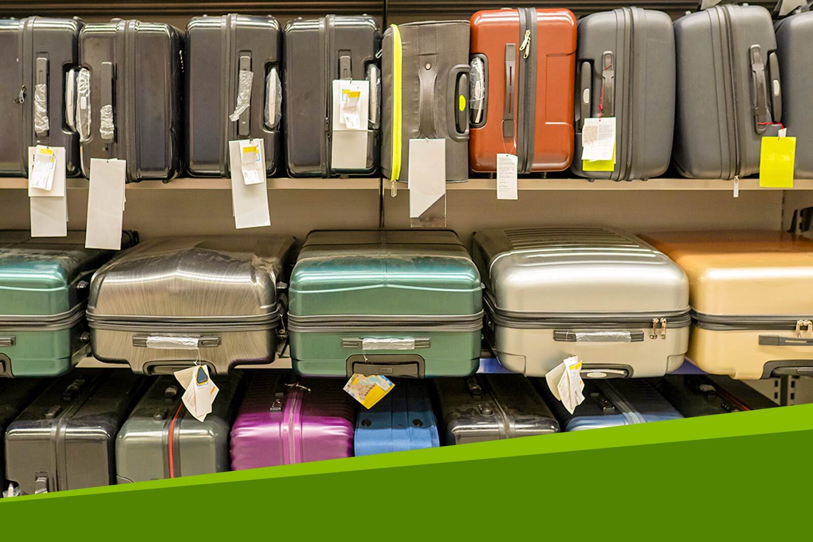 A set of suitcases on the shelves.