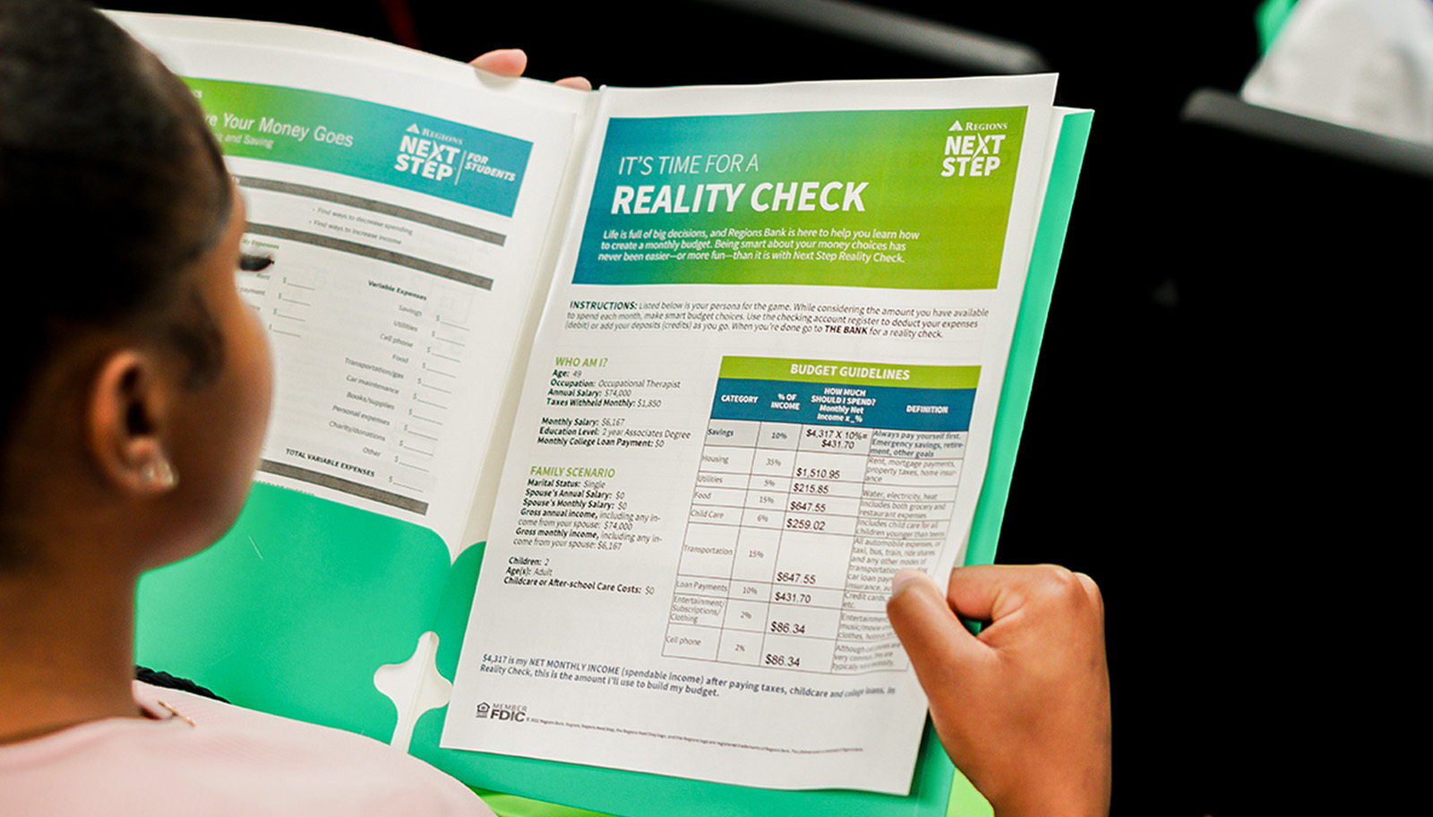 Young student with Regions Reality check folder.