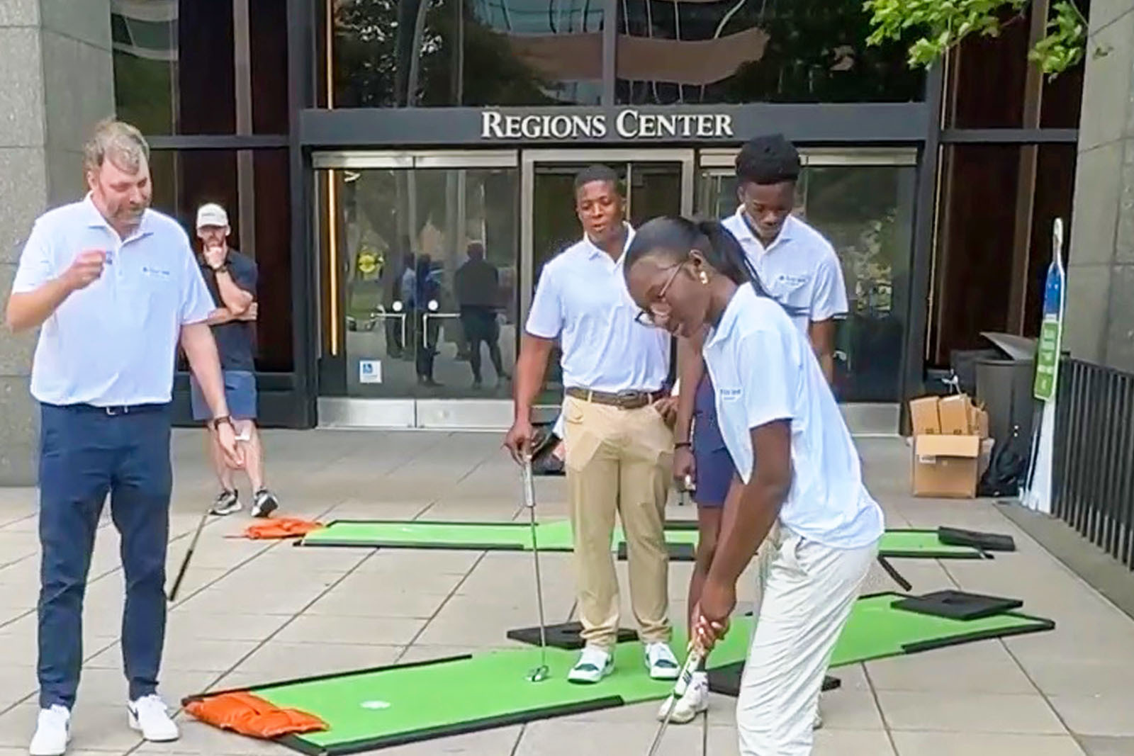 Chip Thomas and First Tee golfers at Regions Center.