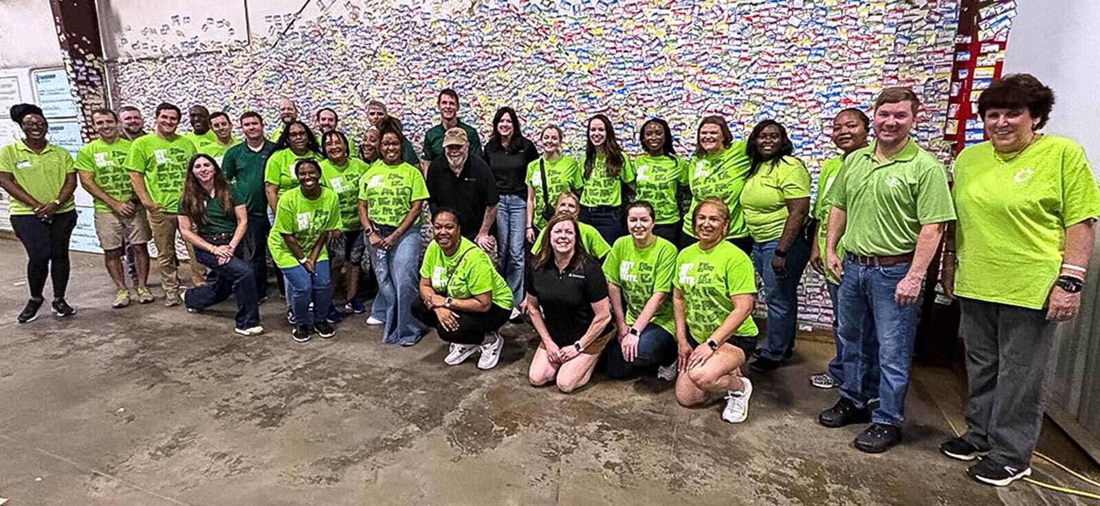 Oliver Williams and 33 members of his Technology, Operations, Digital and Data Risk team volunteered at the Community Food Bank of Central Alabama, serving the final shift at the organization’s current location before its move to a new facility later this summer.