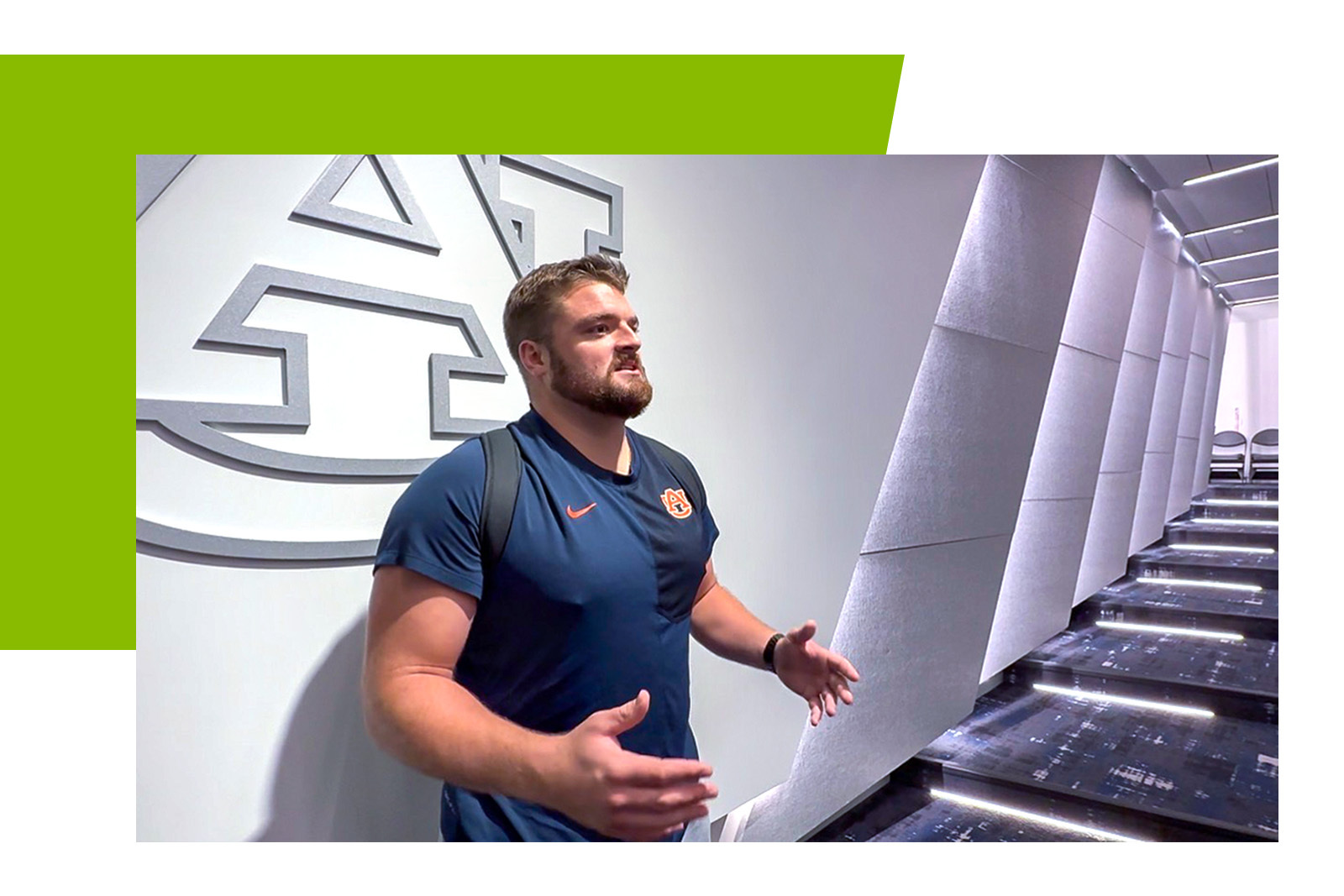 Cole Best, Auburn University athlete behind university logo.