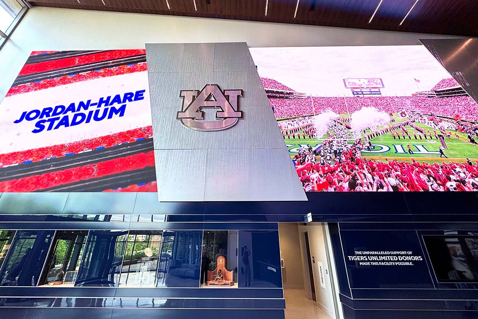 Auburn University, Jordan Hale Stadium logos on large screens.
