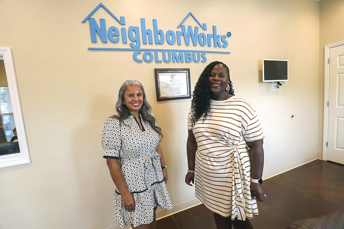 Kristina Justice and Kimberly Hinton-Poole pose in the lobby of NeighborWorks Columbus, a nonprofit founded in 1999.