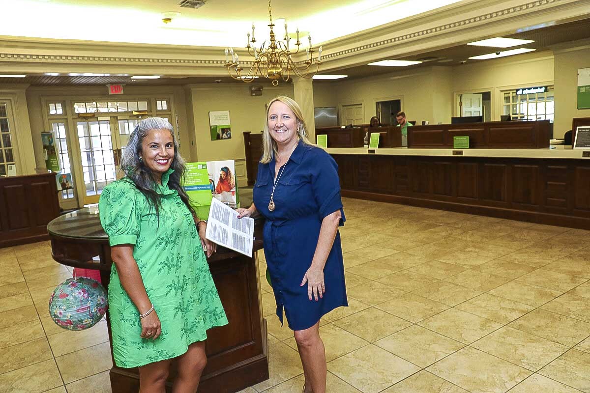 In the lobby of the Regions Valdosta branch, manager Sarah Wickstrom welcomes Kristina Justice on a visit.