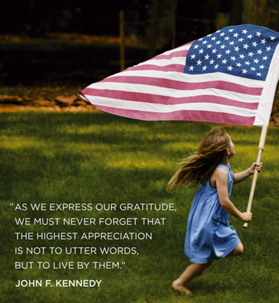 Child running through grass with American flag. Text: "As we express our gratitude, we must never forget that the highest appreciation is not to utter words, but to live by them." - John F. Kennedy.