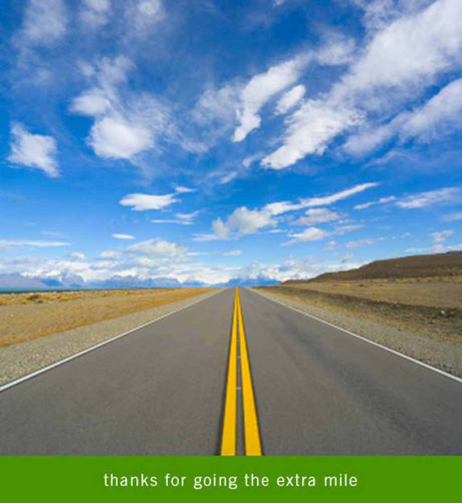 Open highway with blue sky. Text: Thanks for going the extra mile.