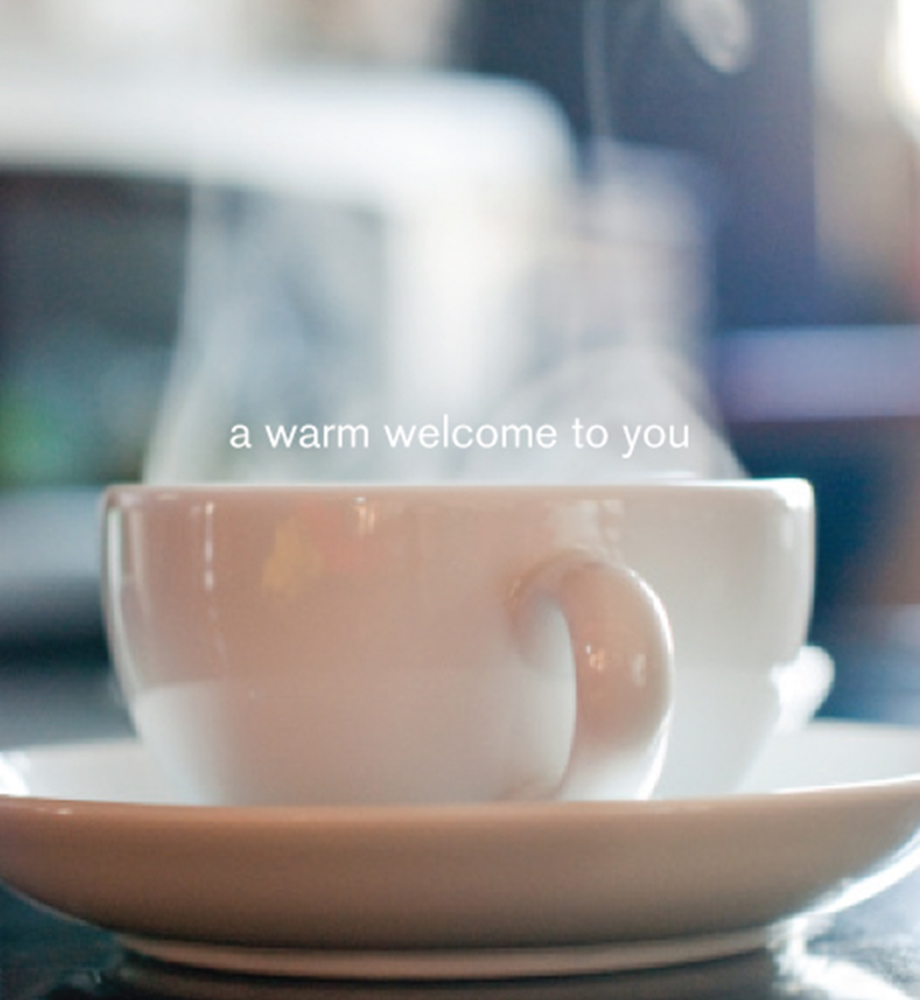 Steaming mug. Text: A warm welcome to you.